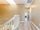 Upstairs hallway with a skylight and wood-look flooring at 903 Pinellas Bayway S # 102, St Petersburg, FL 33715