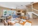 Open-concept living area with fireplace, dining area, and plenty of natural light at 903 Pinellas Bayway S # 102, St Petersburg, FL 33715