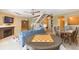 Cozy living room with fireplace, staircase, and neutral tones, perfect for relaxing and entertaining at 903 Pinellas Bayway S # 102, St Petersburg, FL 33715