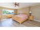 Spacious main bedroom with a ceiling fan and lots of natural light at 903 Pinellas Bayway S # 102, St Petersburg, FL 33715