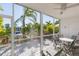 The screened-in porch offers great views of the boat dock, waterway and surrounding greenery at 903 Pinellas Bayway S # 102, St Petersburg, FL 33715