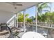 The screened-in porch has beautiful views of the surrounding tropical vegetation and waterway at 903 Pinellas Bayway S # 102, St Petersburg, FL 33715