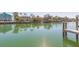 Waterfront homes along canal featuring boat docks and lush landscaping at 903 Pinellas Bayway S # 102, St Petersburg, FL 33715