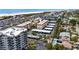 Aerial view of the condo community near the beach with covered parking and a community pool at 915 Beach Rd # 318, Sarasota, FL 34242