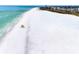 Scenic aerial view of the white sand beach and turquoise waters at 915 Beach Rd # 318, Sarasota, FL 34242