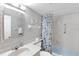 Well-lit bathroom features a vanity with a marble countertop and bathtub with shower at 915 Beach Rd # 318, Sarasota, FL 34242