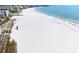 Aerial view of the beach, highlighting its vast sandy expanse and inviting turquoise waters at 915 Beach Rd # 318, Sarasota, FL 34242