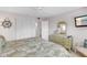Bedroom with a comfortable bed, nautical decor, a dresser with mirror, and plenty of closet space at 915 Beach Rd # 318, Sarasota, FL 34242
