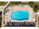 Aerial view of the community pool, seating, and lush green landscaping at 915 Beach Rd # 318, Sarasota, FL 34242