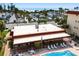 Beautiful exterior view of the building and community pool with lounging area at 915 Beach Rd # 318, Sarasota, FL 34242