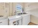 Practical laundry room with a sink and side-by-side washer and dryer for added convenience at 915 Beach Rd # 318, Sarasota, FL 34242