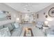 Spacious living room featuring a sofa, armchairs, and a dining area, perfect for entertaining at 915 Beach Rd # 318, Sarasota, FL 34242