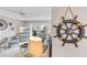 Inviting living room featuring a comfortable sofa, TV, and nautical decor at 915 Beach Rd # 318, Sarasota, FL 34242