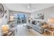 Inviting living room with plush seating, balcony access, and stylish decor at 915 Beach Rd # 318, Sarasota, FL 34242