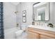 Bright bathroom with marble tile, stylish gold fixtures, and a modern design at 9998 Key Haven Rd, Seminole, FL 33777