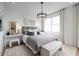 Beautiful bedroom featuring elegant details, a large window, and a cozy relaxing atmosphere at 9998 Key Haven Rd, Seminole, FL 33777