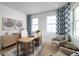 Inviting home office featuring natural light, stylish decor, and comfortable seating ideal for remote work or study at 9998 Key Haven Rd, Seminole, FL 33777