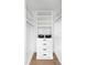 A well-organized walk-in closet featuring custom shelving, drawers, and ample storage space at 9998 Key Haven Rd, Seminole, FL 33777