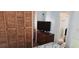 Bedroom with an accent cabinet and a partial bathroom view at 10315 Cortez W Rd # 71-4, Bradenton, FL 34210