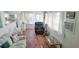 Cozy living room with tile flooring, comfortable seating and an abundance of windows at 10315 Cortez W Rd # 71-4, Bradenton, FL 34210