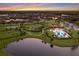 Aerial view of a beautiful community featuring a pool, clubhouse, playground, sports courts and lush landscaping at 14326 Flat Woods Ter, Lakewood Ranch, FL 34211