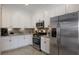 Stylish kitchen featuring stainless steel appliances, granite countertops, and ample cabinet space for storage at 14326 Flat Woods Ter, Lakewood Ranch, FL 34211