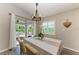 Cozy dining area with sliding glass doors leading to an outdoor patio area with a view of the garden at 16117 59Th E Ct, Parrish, FL 34219
