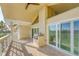 Spacious balcony featuring a built-in grill, tiled floor, and sliding glass doors with views at 1762 Bay St # 401, Sarasota, FL 34236
