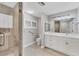 Nicely updated bathroom featuring a glass enclosed shower, a toilet and a single vanity at 1762 Bay St # 401, Sarasota, FL 34236
