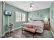 Serene bedroom with coastal decor, wood floors, and natural light from a large window at 2625 Terra Ceia Bay Blvd # 503, Palmetto, FL 34221