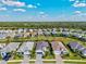 An aerial view of the neighborhood showcasing well-maintained homes and landscaping at 2720 Butterfly Jasmine Trl, Sarasota, FL 34240