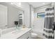 Bright bathroom with a shower-tub combo, gray and white color scheme, and modern vanity at 2720 Butterfly Jasmine Trl, Sarasota, FL 34240