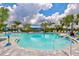 Large community pool with splashpad, offering ample space for swimming and Gathering fun at 2720 Butterfly Jasmine Trl, Sarasota, FL 34240