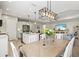 Open-concept kitchen and dining area, showcasing a seamless flow between cooking and dining at 2720 Butterfly Jasmine Trl, Sarasota, FL 34240