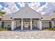 A beautiful lodge featuring a spacious outdoor seating area perfect for relaxing and entertaining guests at 2720 Butterfly Jasmine Trl, Sarasota, FL 34240