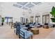 Bright community lounge area features elegant seating, tables, and stylish lighting fixtures for a welcoming atmosphere at 2720 Butterfly Jasmine Trl, Sarasota, FL 34240