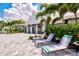 Resort-style pool area with comfortable lounge chairs, providing a luxurious outdoor experience at 2720 Butterfly Jasmine Trl, Sarasota, FL 34240