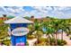 Beautiful Bradenton Riverwalk view with colorful sign and palm trees, showcasing a vibrant community setting at 2720 Butterfly Jasmine Trl, Sarasota, FL 34240