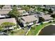 An aerial view highlights the building's architectural details, surrounded by landscaping and a scenic pond at 2832 74Th W St # 2180, Bradenton, FL 34209