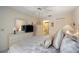 Bedroom with a view to the bathroom, featuring light walls and classic design elements at 2832 74Th W St # 2180, Bradenton, FL 34209