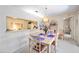 Dining room features pass-through to kitchen, bright light fixture and comfortable seating at 2832 74Th W St # 2180, Bradenton, FL 34209