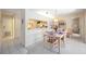 Cozy dining room with a chandelier and views of the kitchen and other rooms at 2832 74Th W St # 2180, Bradenton, FL 34209