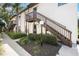A condo building with beautiful landscaping and stairs to the front door at 2832 74Th W St # 2180, Bradenton, FL 34209
