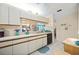 Bright kitchen with ample counter space, white cabinets, and modern appliances at 2832 74Th W St # 2180, Bradenton, FL 34209