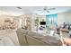Bright living room with sliding glass doors and neutral decor with comfortable seating at 2832 74Th W St # 2180, Bradenton, FL 34209