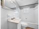 Bathroom with white tile, a sink, toilet, and a combined tub and shower at 301 W Woodlawn Ave, Tampa, FL 33603