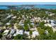 Breathtaking aerial view of the waterfront neighborhood with lush greenery and picturesque canals and waterways at 3629 Almeria Ave, Sarasota, FL 34239