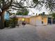 Inviting backyard with string lights, a grill, and an outdoor dining area, ideal for entertaining guests at 3629 Almeria Ave, Sarasota, FL 34239
