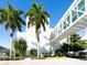 Modern medical building with glass skywalk, palm trees, and well-kept landscaping at 3629 Almeria Ave, Sarasota, FL 34239