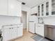 Bright kitchen featuring white cabinets, stainless steel appliances, and a seamless design at 3629 Almeria Ave, Sarasota, FL 34239